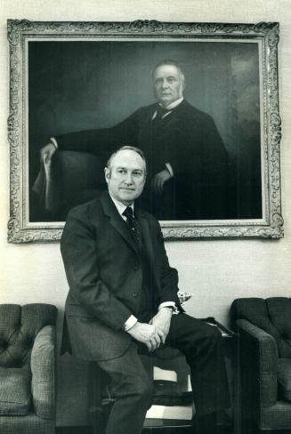 Chairman G. Allan Burton sits in front of a portrait of the founder of the Simpsons company, Robert Simpson. Simpson was succeeded by Henry Fudger, who was followed by Allan Burton's father