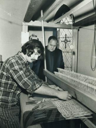 Artist Norman Butler weaves a religious tapestry on his home-made loom, in the back room of St
