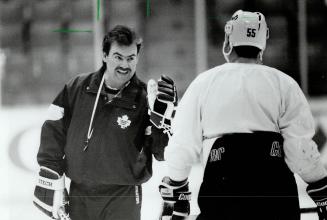 Now hear this: Maple Leafs coach Pat Burns tries to get his point across to rookle defenceman Drake Berehowsky yesterday at practice
