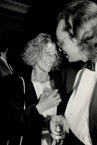 Jackie Burroughs, named Best Actress for her role in A Winter Tan, sips champagne with date John Gundy at a party at the Four Seasons Hotel last night