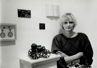 Mixed-media: Jane Buyers and Volere: To Want, To Desire -- tiny bronze cart, with sculptures and ceramic book