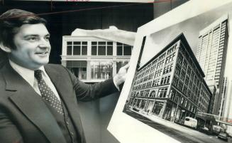 E.G. (Ted) Burton, president of Simpsons Ltd. looks over artist's conception of company's refurbished main downtown store. The 80-year-old store, desi(...)