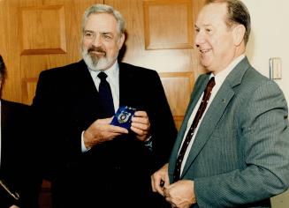 Force is with Raymond Burr. Actor Raymond Burr (left), who is in Toronto shooting a new Perry Mason movie, was presented with a police badge yesterday by Chief Jack Marks at police headquarters