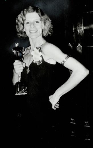 If they could see me now . . . Jackie Burroughs proudly displays the award she won last night as Best Supporting Actress for her role in the movie the Grey Fox, which won seven Genies