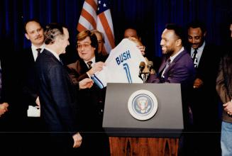 Outgoing U.S. President George Bush and Prime Minister Brian Mulroney got special baseball sweaters yesterday from the Toronto Blue Jays