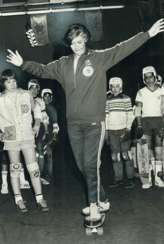 Young skateboarders admire style of Iona Campagnolo, minister of fitness and amateur sport, during Sportsmen's Show