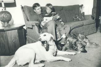 James Carey with Marc, 6 and dogs Candy (white) and Scruffy