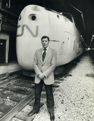 Supercharged chief of CN's passenger services, Garth Campbell, 49, stands in front of the Turbo locomotive on Track 1 at Toronto's Union Station. The train has hit 140 m.p.h. on its Montreal run