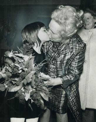 Margaret Campbell, a former Toronto controller and family court judge, gets a big kiss from granddaughter Kathy Bartok, 8, after winning the Liberal n(...)