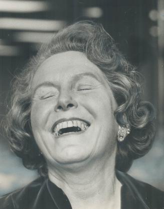 Deliriously happy, Mrs. Margaret Campbell celebrates her tight victory for the fourth Board of Control berth. She edged out former Alderman George Ben