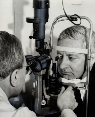 A mayor gets a check-up. Dr. Ellis Shenken tests Scarborough Mayor Ab Campbell's for glaucoma at the opening yesterday of the borough's Triple Test Centre at 29 Civic Road. He passed
