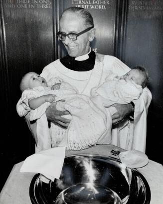 Baptizes grandchildren. Rev. Ronald Campkin, an Anglican deacon and a member of The Star proof room staff, baptized his two grandchildren-both girls-S(...)