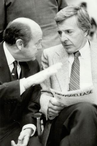 Jimmy Pattison, left, the tough chief of Expo, discusses the fair with director Herb Capozzi