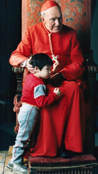 Gerald Emmett Cardinal Carter is joined by 3-year-old Mathew for the filming of a 30-second TV commercial about the Catholic church's annual ShareLife(...)