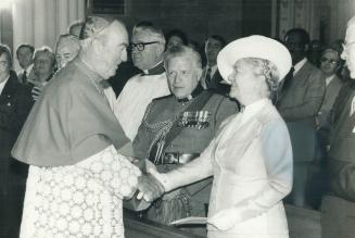 Cardinal returns, Gerald Emmet Cardinal Carter greets Lieutenant Governor Pauline McGibbon at a solemn liturgical reception at St. Michael's Cathedera(...)