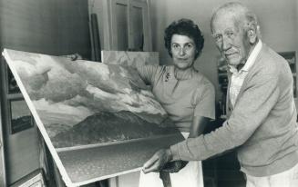 Casson with Cicely Bell - Chairman of the Board of the McMichael Gallery with an untitled painting