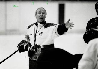 Hard at it: Leaf coach Doug Carpenter, left, lectures his troops, including a despondent looking Dave Reid, yesterday at Maple Leaf Gardens