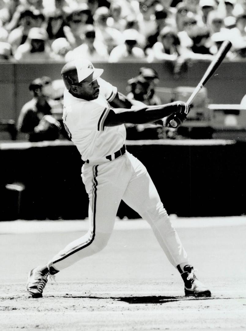 Close Call: Joe Carter swings and misses in the first inning at the SkyDome yesterday, but connects on a later pitch for his 17th home run of the season