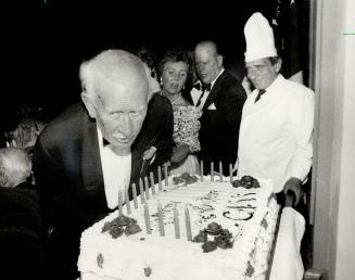 Birthday gala: A.J. Casson, last survivor of the Group of Seven, blows out candles on his birthday cake last night at the Royal York Hotel. About 600 (...)