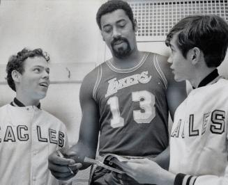 The Greatest basketball player, Wilt the Stilt Chamberlain, the 7 feet 2 inches tall idol of millions of teenagers, autographs programs for Shane Armi(...)