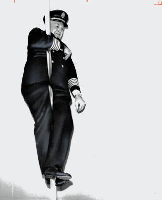 Virtually a lost art for the modern Metro firefighter, Toronto Fire Chief Charles Chambers shows how to slide down the brass pole at Adelaide St. fire(...)