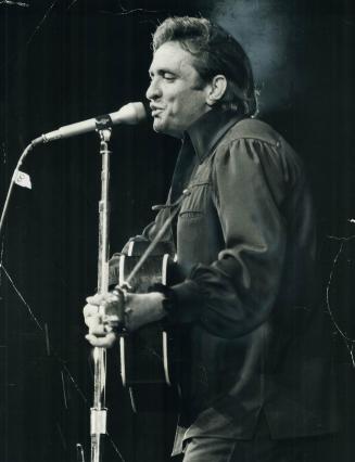 Last night's downpour didn't faze country and western singer Johnny Cash in his concert at the CNE