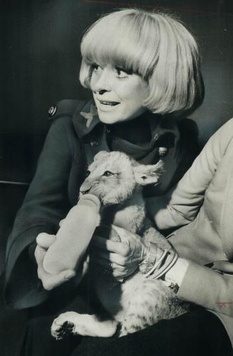 Actress Carol Channing with lion friend