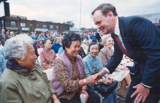 Lending a hand in Toronto. Jean Chretien welcomes some of the 400 voters at yesterday's rally for Broadview-Greenwood Liberal hopeful Dennis Mills. Th(...)