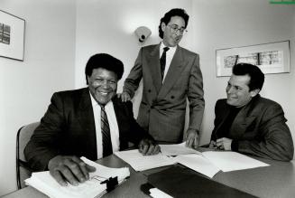 Legal dance: Chubby Checker, left, in Toronto, with lawyer David Hlmelfarb and manager Tony DeLauro yesterday, is suing McDonald's Canada for using the song The Twist to promote McTwist fries