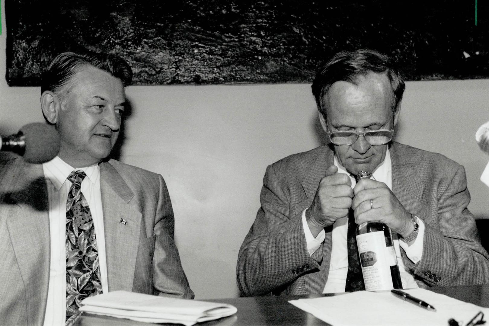 Checking it out: Liberal MP Jesse Flis (Parkdale High Park) looks on yesterday as party leader Jean Chretien sniffs Chinese cooking wine which residents say has become popular in the area