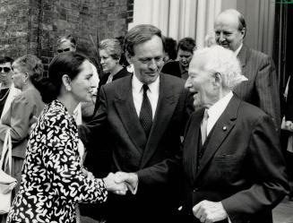 Solemn Occasion: Jean Chretien, centre, and his wife, Aline, greet former Governor General Roland Michener at the funeral of lawyer Pierre Genest in Toronto yesterday