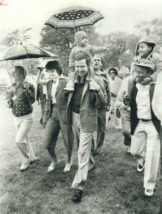 Conservative leader Joe Clark with is 20-month-old daughter, Catheriene, on his shoulders, was part of the parade of politicians who trekked to Centre(...)