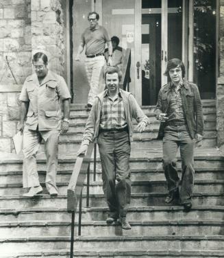 Clark leaves a transition-of-power committe meeting with advisers Bill Neville (left), Jock Osler (rear) and Donald Boyle