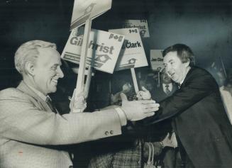 Party leader Joe Clark (right) grabs supporter's hand during Tory rally at Cedarbrae Collegiate