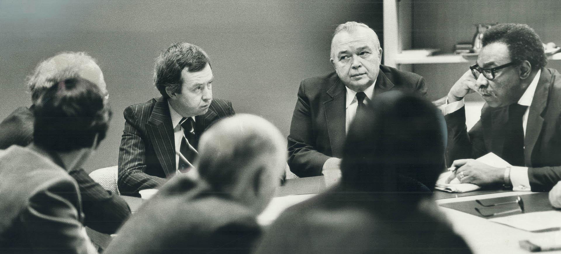 Clark in conference with Steve Paprowski, House whip, and Hamilton MP Lincoln Alexander (right)