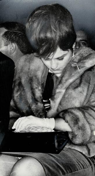 Lynne Chuvalo drops her head as her husband George undergoes a battery of Cassius Clay's cruel body punches