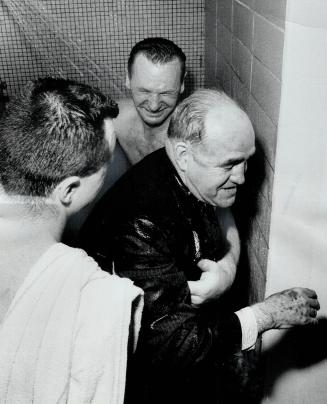 The party wasn't dry. King Clancy gets the traditional dousing in the showers as Leafs celebrate their Stanley Cup win. Making sure he gets good and w(...)