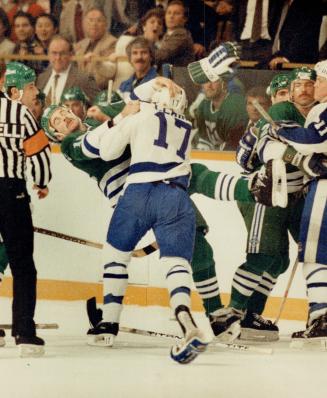 Take that! Hartford defenceman Scot Kleinendorst is heading for a great fall after he had the temerity to tangle with Toronto's Wendel Clark (17) in t(...)