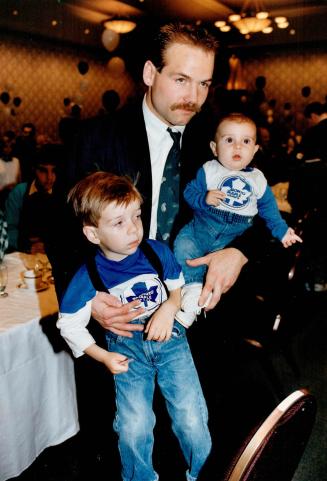 A handful: These fans kept Wendel Clark occupied at yesterday's Meet the Leafs luncheon