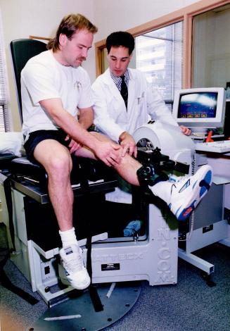 Wendel and the beast. Dr. Michael Clarfield tests Wendel Clark on KIN COM, also known as the Beast, a machine that measures a knee's strength