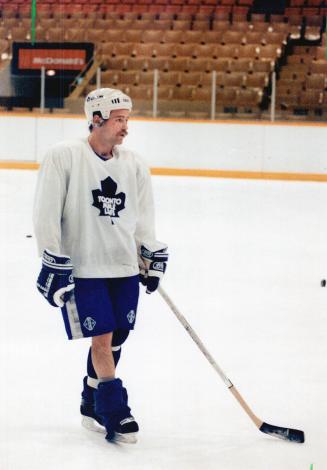Isn't that tiny tim? He may look like Bob Cratchit's little boy, the one with the suspect leg, but actually it's just Wendel Clark, having some trouble with one of his socks