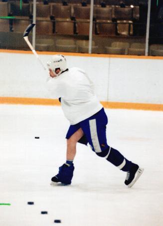 Isn't that tiny tim? He may look like Bob Cratchit's little boy, the one with the suspect leg, but actually it's just Wendel Clark, having some trouble with one of his socks