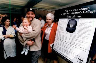 Standing up for Women's. Toronto Maple Leaf Wendel Clark, holding daughter Kylie, yesterday helps launch Men For Women's project to save Women's College Hospital