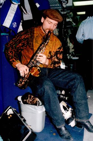 Wendel's Swan Song. Leafs' Wendel Clark plays a few notes on the saxophone yesterday while gathering up his gear at the Gardens. Clark, who played the(...)