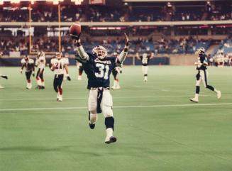 Argonaut Mike Clemons scores the clinching touchdown in a 34-25 CFL Eastern semi-final win over Ottawa Rough Riders in the dome yesterday. Argos play Winnipeg Blue Bombers in the final
