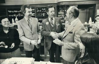 Birthday boy. Toronto Mayor Fred Beavis gets smiles, handshakes and a chorus of Happy Birthday from Conservative Leader Joe Clark and Broadview Tory c(...)