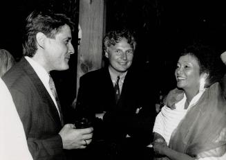 All smiles: Among those at the In Country party were Ralph Benmurgui, left, Ivan Fecan and Adrienne Clarkson,