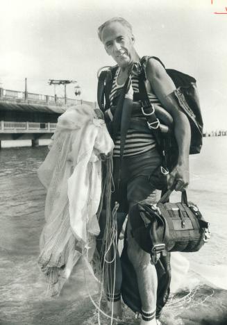 Skydiver Bill Cole is in style for parachuting - 60 years ago