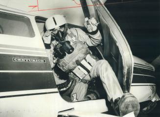 Parachutist Bill Cole of Mississauga gets set for a night jump from 30,000 feet over the Toronto International Airport