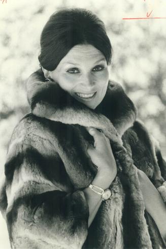 Barbara Collier, soprano, models $4,000 Empress chinchilla jacket with petal collar